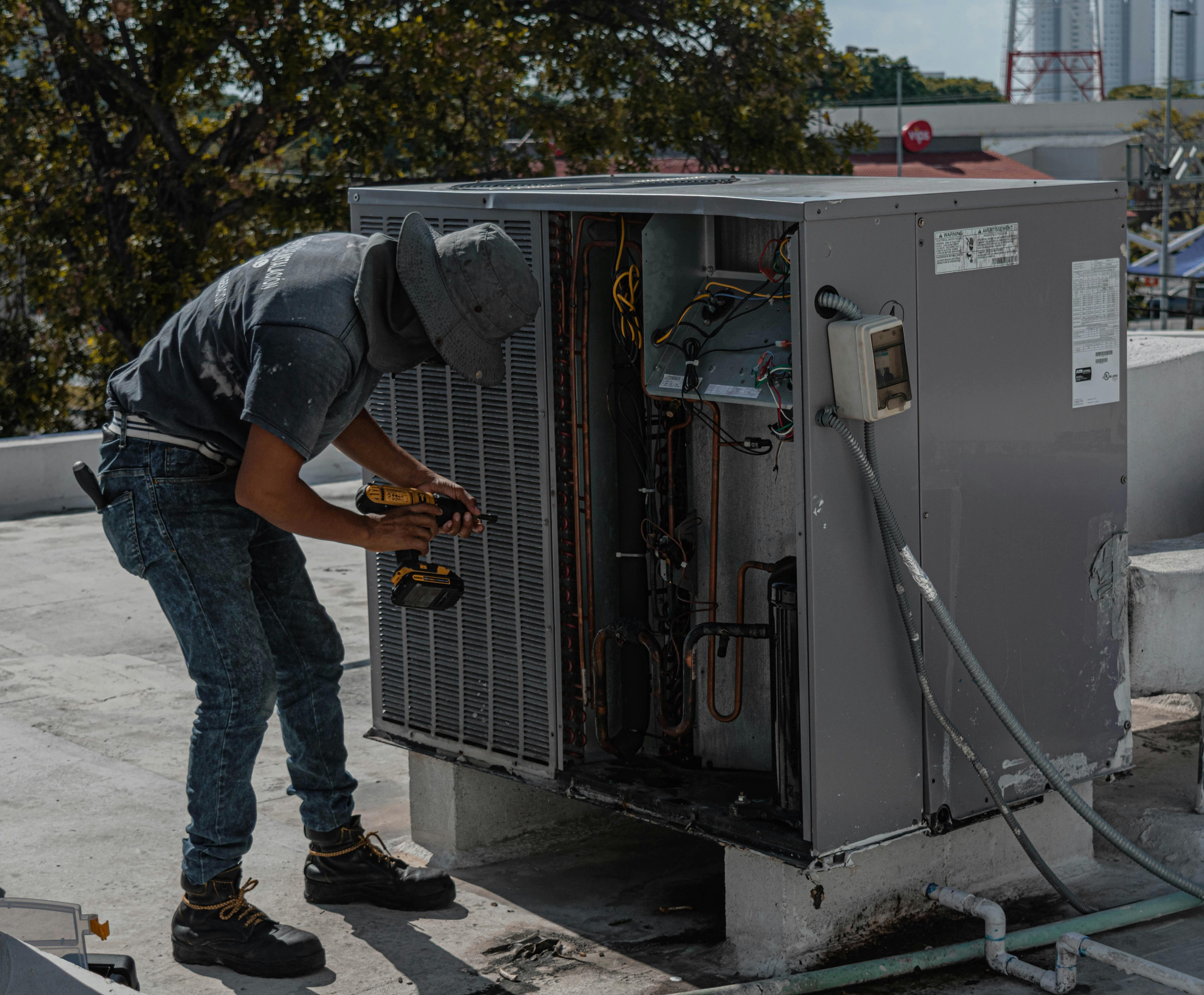 HVAC technician working on equipment